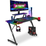 XTREME by O&S Carbon Fibre Effekt Z-Rahmen RGB PC Computergaming-Schreibtisch mit RGB-LED-Lichtern, Monitorständer, Desktop-Tower-Ständer-Trolley, Kabelmanagement, Headset-Haken und Getränkehalter, Schwarz